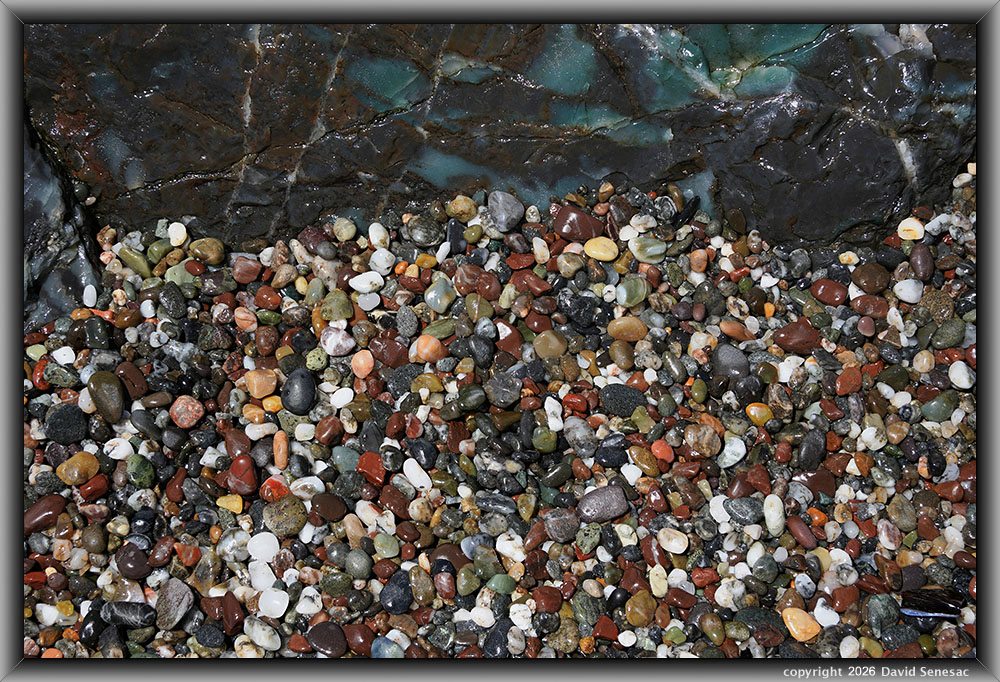 VP08847-69h surf smoothed, wet mélange beach stones atop boulder. VP08847-69h